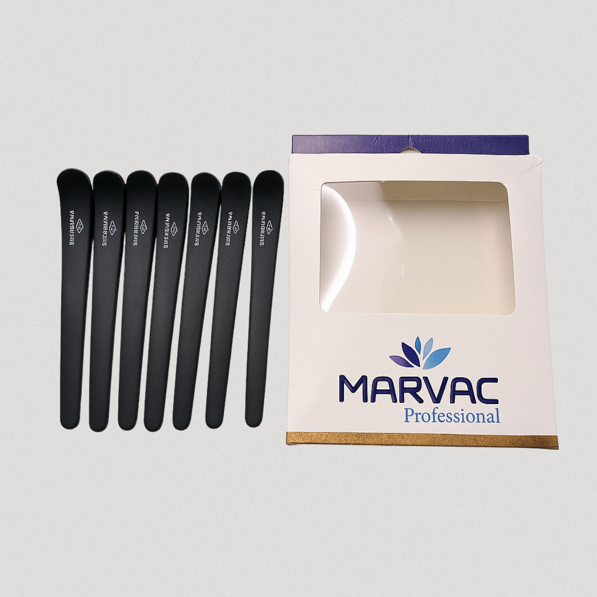 Carbon fiber hair clips used for precision hair sectioning in salon
