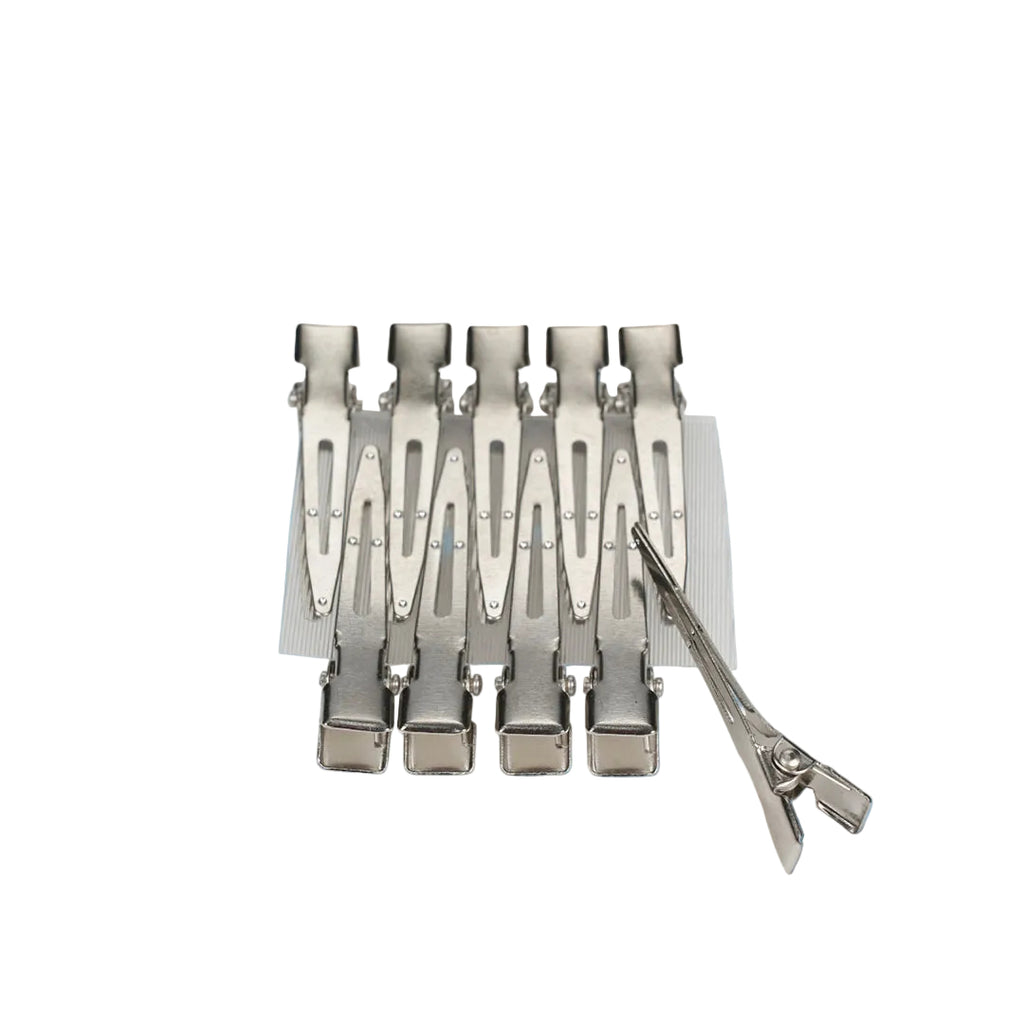 Small silver metal hair clips designed for fine hair control in salon